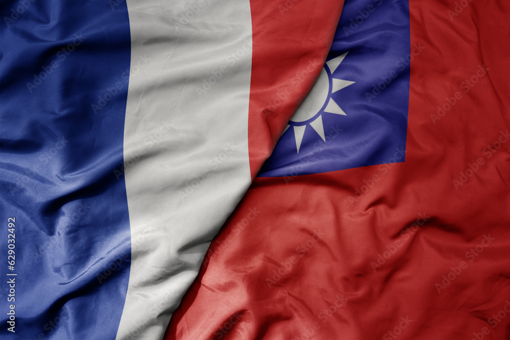 big waving realistic national colorful flag of france and national flag of taiwan .