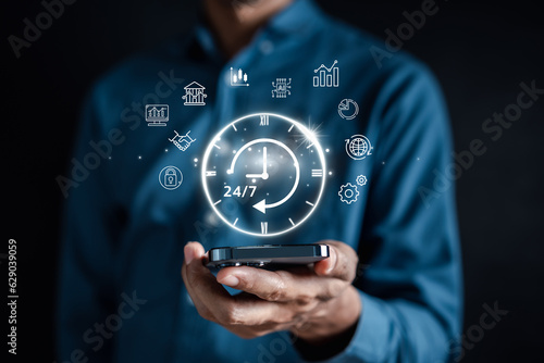 Nonstop service 24 hr concept. businessman hand holding virtual 24/7 with clock on hand for worldwide nonstop and full-time available contact of service concept. customer service.