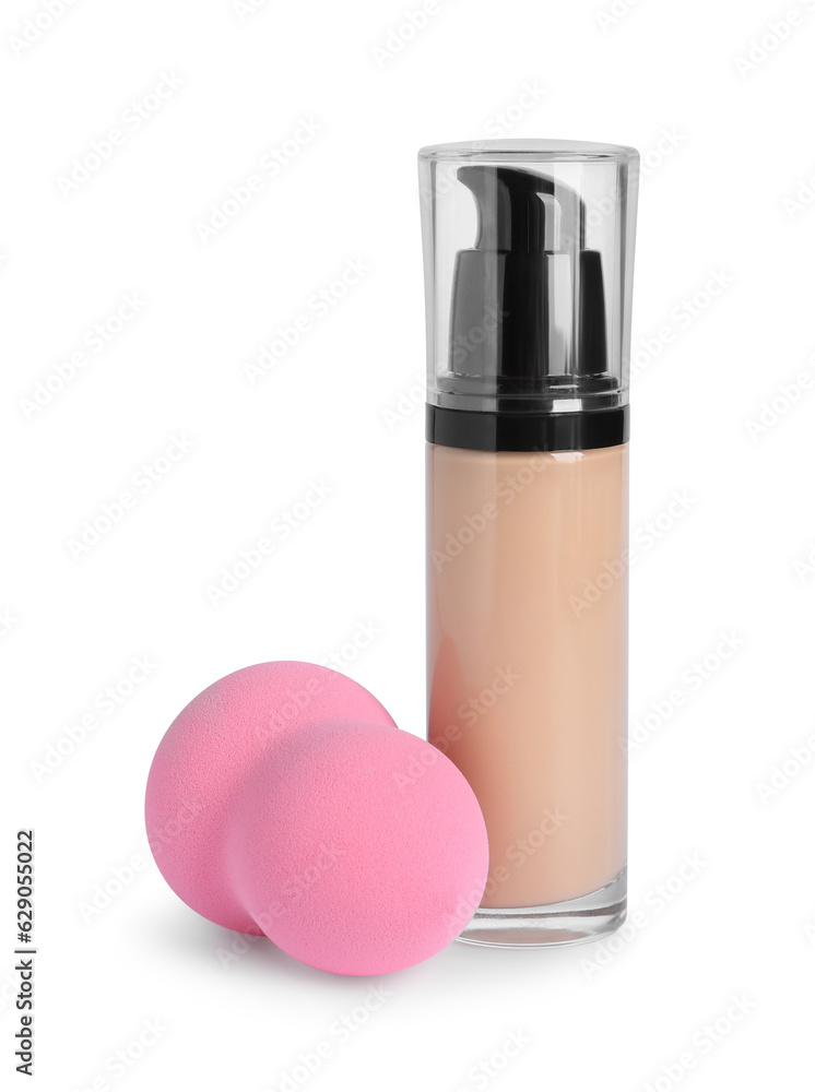 Bottle of skin foundation and sponge on white background. Makeup product Bottle of skin foundation and sponge on white background. Makeup product