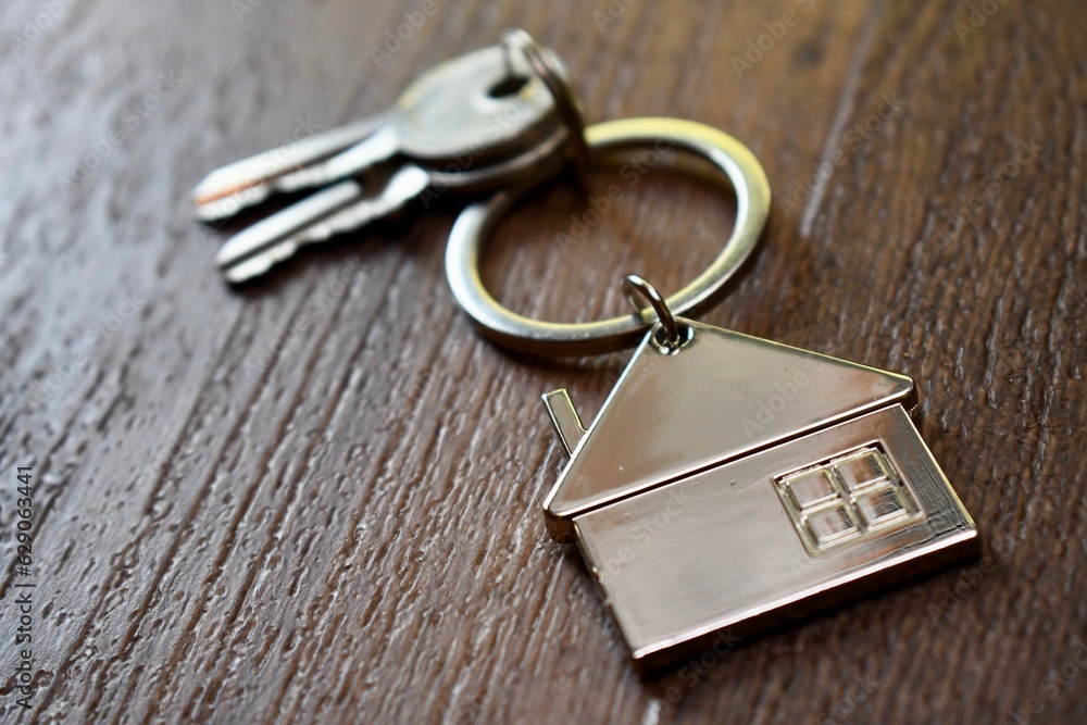 House keys on a wooden table House keys on a wooden table
