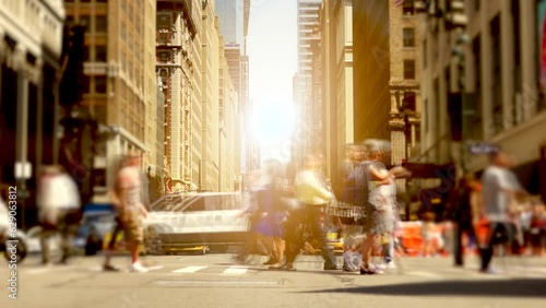 Business people walking on crowded city street in rush hour traffic photo