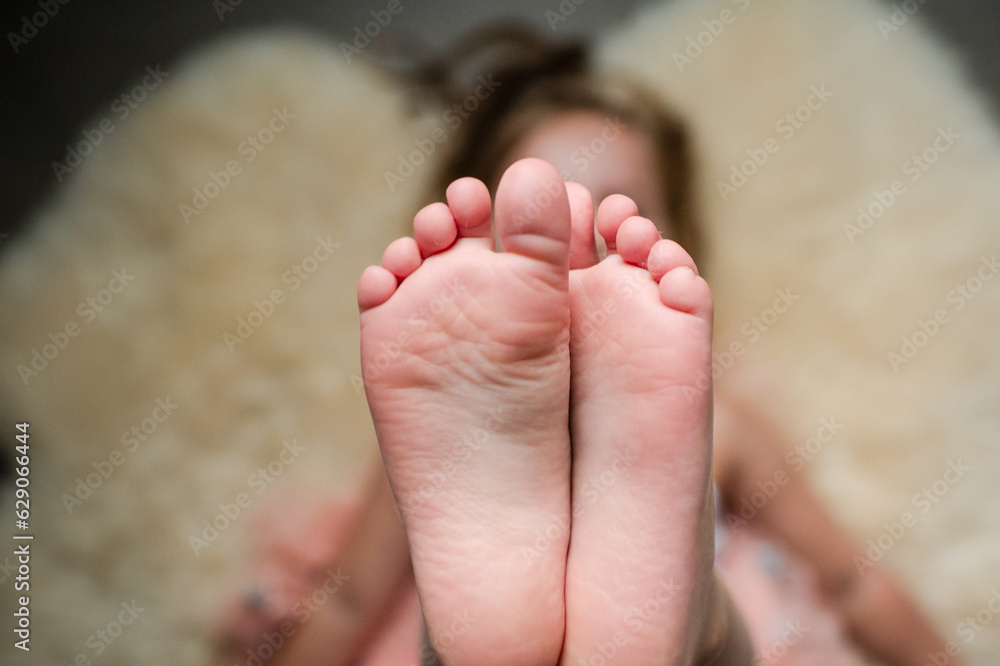 Child's feet. Child's feet.