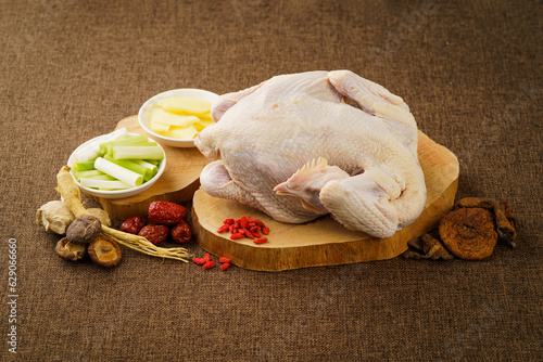 Ingredients required for chicken stew with mushrooms on a dark vintage background