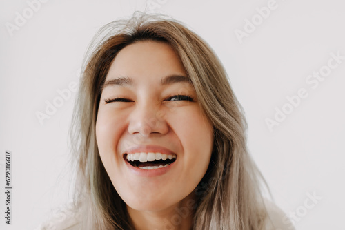Happy smile and laugh face asian woman portrait isolated on white background.