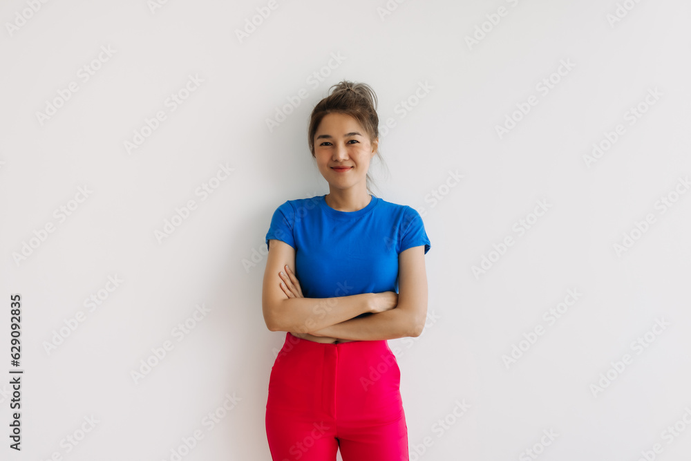 Smile and laughing asian woman with crossed arms isolated on white. Smile and laughing asian woman with crossed arms isolated on white.