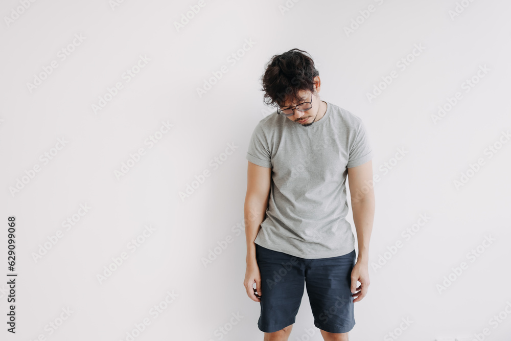 Bored face asian man stand boringly in full body isolated on white. Bored face asian man stand boringly in full body isolated on white.