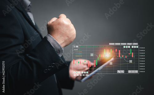 concept of online stock trading. Businessmen use tools to find stocks that are trending up to buy or Making a decision to sell to stop loss or cut loss the stock.
