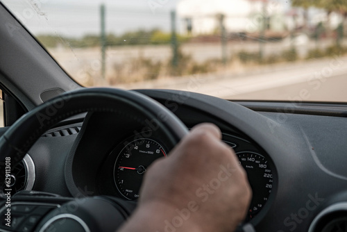 old man hands on steering wheel, driving car, road trip © Ela