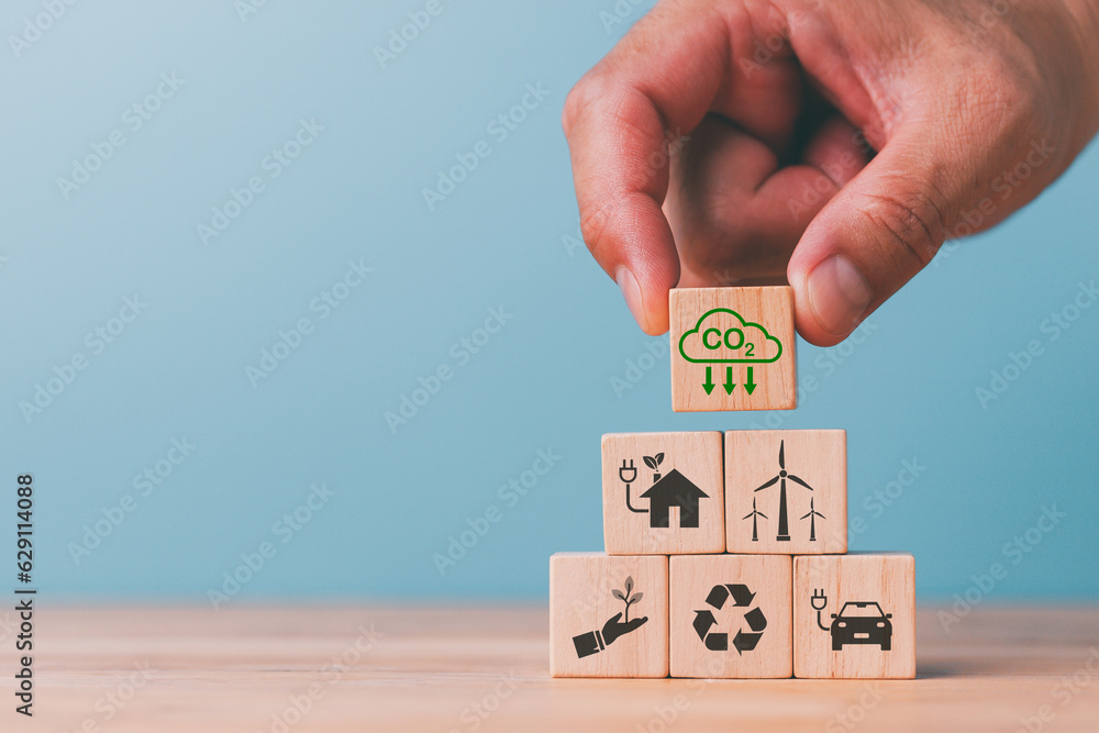Reduce CO2 emission concept. Sustainable development and business based on renewable energy.Renewable energy-based green businesses can limit climate change and global warming. - obrazy, fototapety, plakaty 