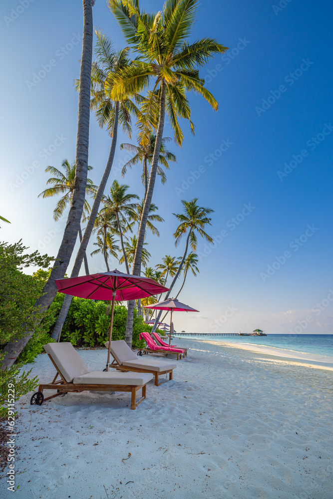 idyllic beach banner. Panoramic exotic landscape, couple beds under umbrella and palm trees. Happy love honeymoon travel destination horizon coast. Tropical island, sunshine blue sea sky white sand