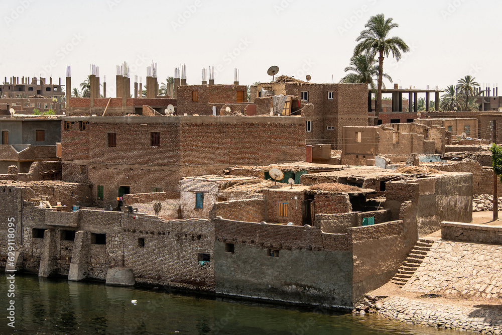 Panoramic view of fertile banks of Nile and everyday life during river cruise River near Luxor Egypt direction assuan