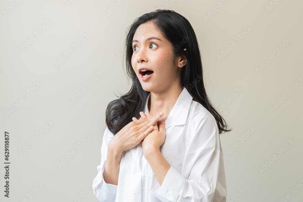 Smile positive, feeling amazed asian young woman wearing casual shirt, portrait of pretty female with black long hair, standing expression gesture face surprised looking at camera on white background. Smile positive, feeling amazed asian young woman wearing casual shirt, portrait of pretty female with black long hair, standing expression gesture face surprised looking at camera on white background.