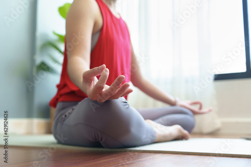 Closeup woman hand yoga lotus position at home. Breathing, Working out, Meditation, wellness concept