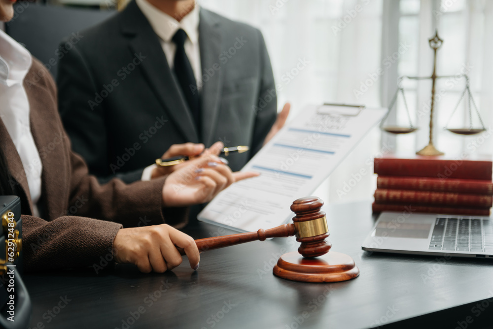 Business and Male lawyer or judge consult having team meeting with client, Law and Legal services concept.Customer service good cooperation in office. Business and Male lawyer or judge consult having team meeting with client, Law and Legal services concept.Customer service good cooperation in office.