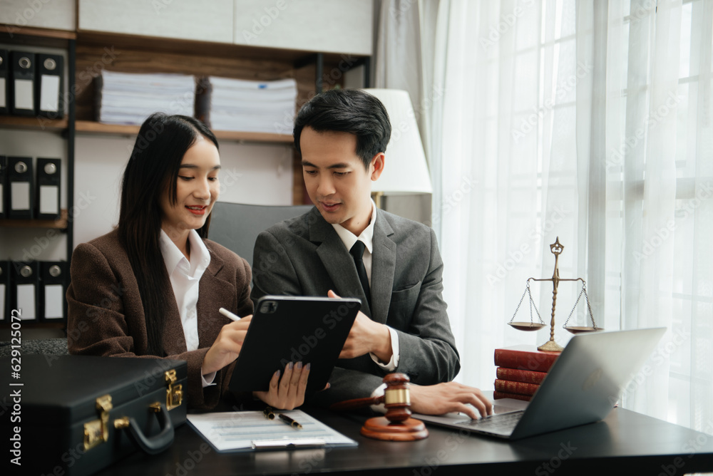 Business Asian people and lawyers discussing contract papers sitting at the table. Concepts of law, advice, legal services. Business Asian people and lawyers discussing contract papers sitting at the table. Concepts of law, advice, legal services.