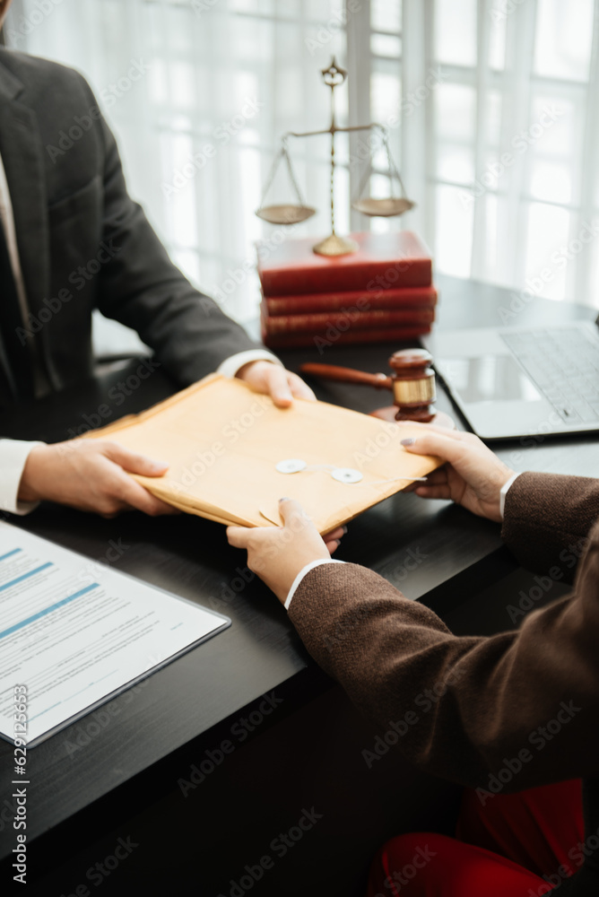 business people and lawyers discussing contract papers sitting at the table. Concepts of law, advice, legal services. in morning light. business people and lawyers discussing contract papers sitting at the table. Concepts of law, advice, legal services. in morning light.