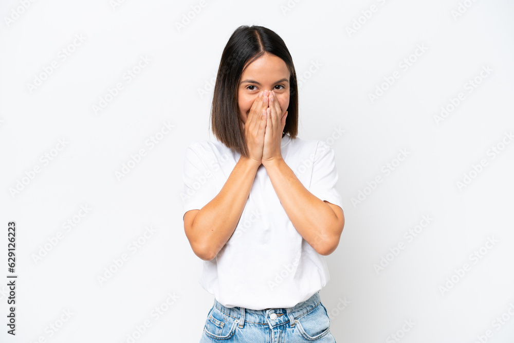 Young caucasian woman isolated on white background happy and smiling covering mouth with hands Young caucasian woman isolated on white background happy and smiling covering mouth with hands