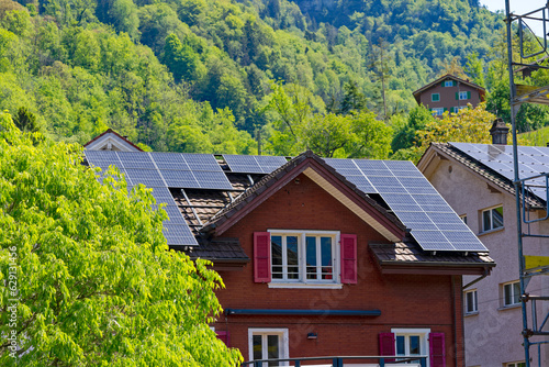 Pitched roof house with solar panels on rooftop at Swiss village of Sisikon  Canton Uri  Switzerland. Photo taken May 22nd  2023  Sisikon  Switzerland.