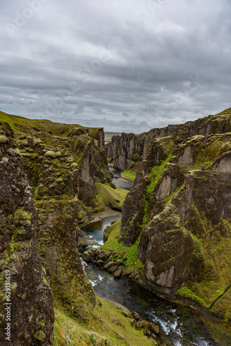 Unique rugged landscape of Fjaðrárgljúfur canyon covered by green moss, located in southern Iceland. 