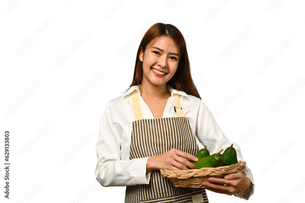 Smiling woman holding basket with avocado isolated on white background. Vegan food, healthy lifestyle concept Smiling woman holding basket with avocado isolated on white background. Vegan food, healthy lifestyle concept