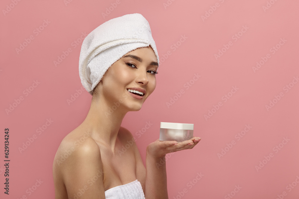 Female model demonstrates container for moisturizer. Female model demonstrates container for moisturizer.