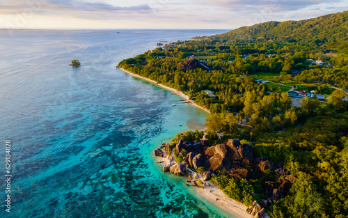 Anse Source d Argent  La Digue Seychelles  drone view at a tropical beach during sunset