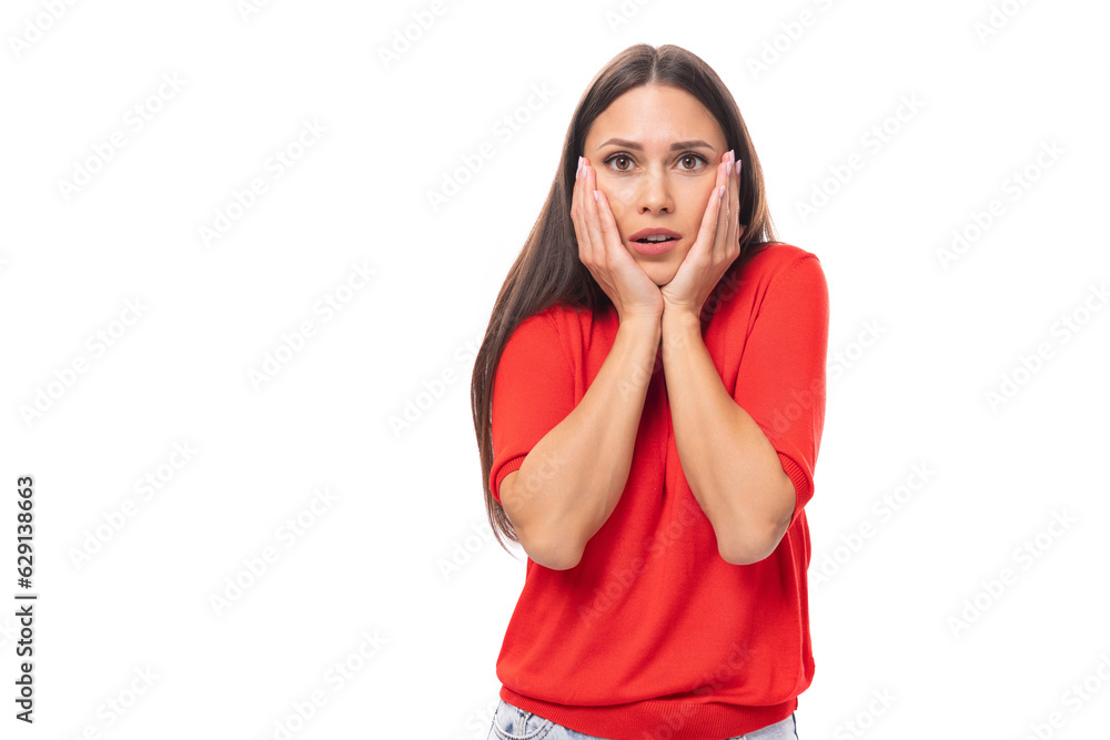 young excited brunette lady dressed in a red t-shirt on a white background young excited brunette lady dressed in a red t-shirt on a white background