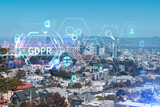 Panoramic view of San Francisco skyline at daytime from hill side. Financial District, residential neighborhoods. GDPR hologram, concept of data protection regulation and privacy for all individuals