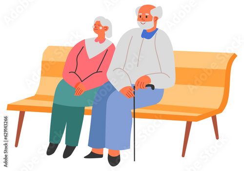 Grandmother grandfather sitting on bench in park
