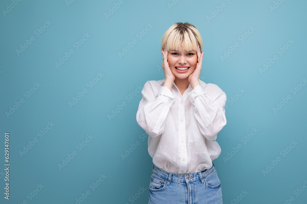 shy pretty blond office worker woman in white shirt and jeans. people lifestyle concept shy pretty blond office worker woman in white shirt and jeans. people lifestyle concept