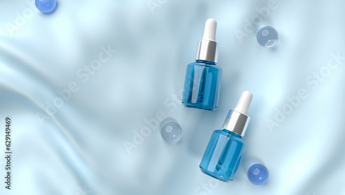 3d render of two blue serum bottle for skin care on blue fabric background.