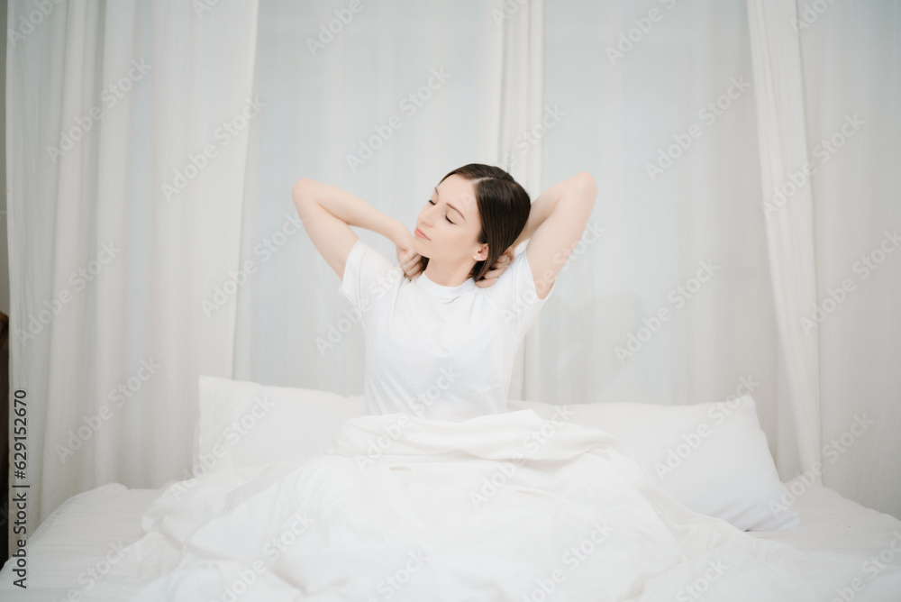 Image of beautiful woman resting in white bed at bedroom. in morning . Lifestyle at home concept.. Image of beautiful woman resting in white bed at bedroom. in morning . Lifestyle at home concept..