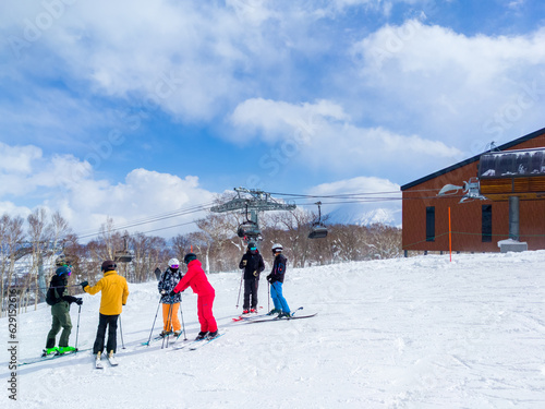 Skiers chatting by a lift station (Niseko, Hokkaido, Japan) photo