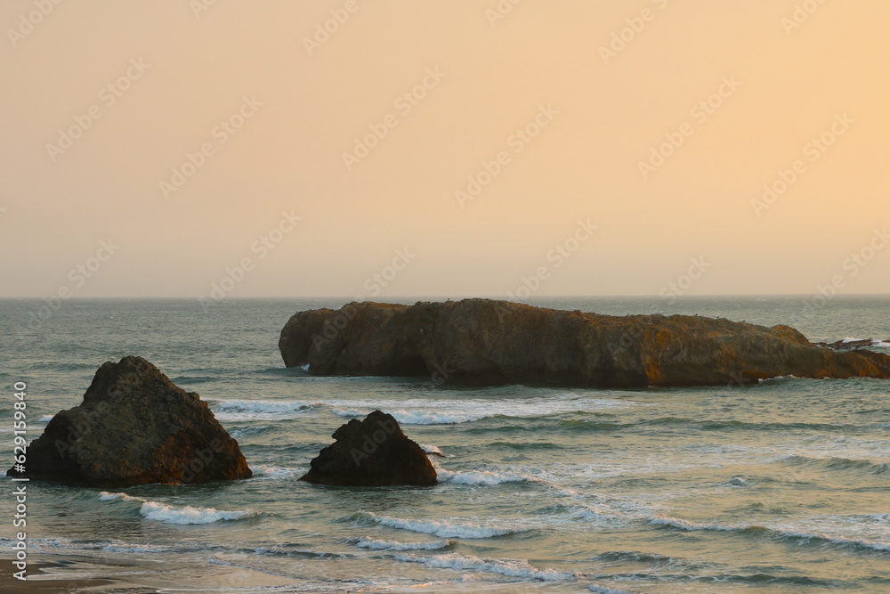 View of the cliffs in the Pacific Ocean at sunset.