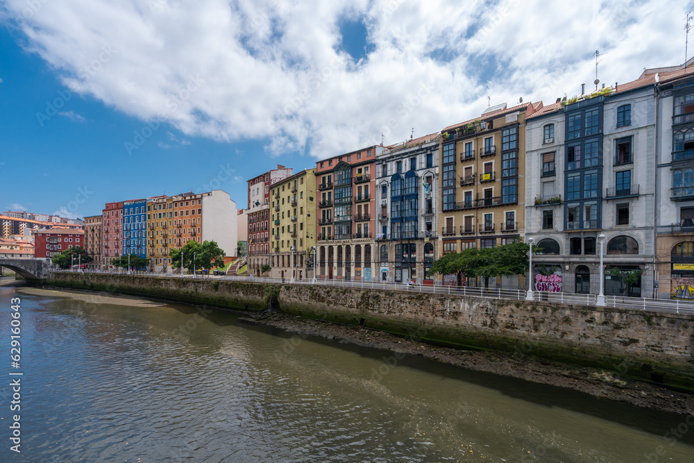 Fototapeta premium Promenade area of the River Nervion. In background the old city of Bilbao in front plane the river Nervion. Travel destination in North of Spain, Basque Country