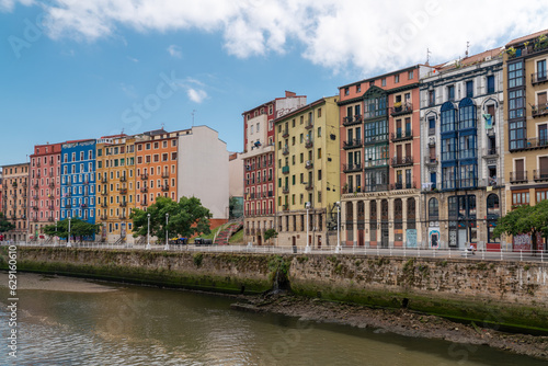 Bilbao, SPAIN - July 19 2022: City center of Bilbao. Beautiful building architecture. View of River Nervion and his promenade area. Travel destination in North of Spain. Largest city in Basque Country © alexemarcel
