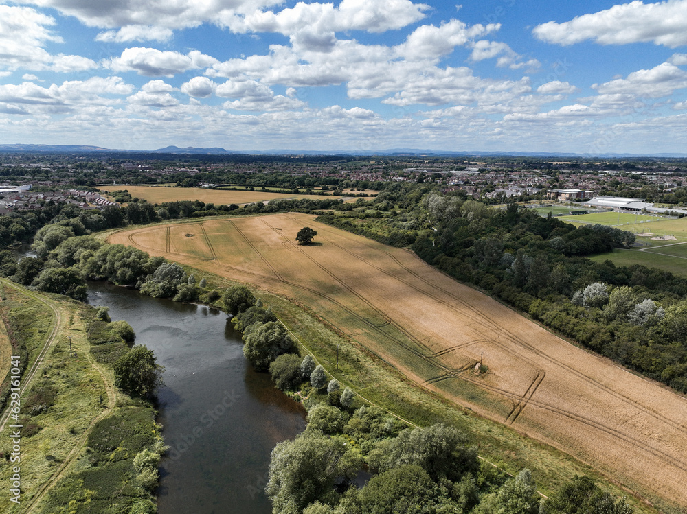 Drone view of a river and fields in England on a summers day