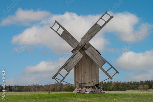 Grain mill on the summer landscape. Windmill and natural background pattern. Hiiumaa, small island in Estonia.