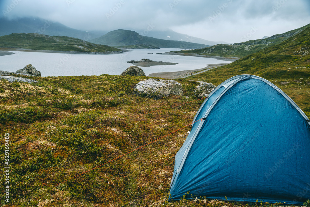 Wild camping with a tent in northern Europe traveling in Scandinavia, a national park in Norway, beautiful landscape Wild camping with a tent in northern Europe traveling in Scandinavia, a national park in Norway, beautiful landscape