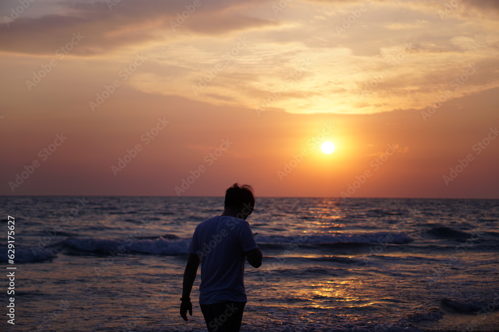 man silhouette against sunset