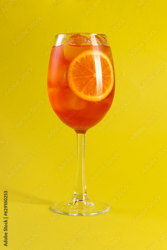 Orange cocktail. Aperol syringe. On a yellow background. Orange cocktail. Aperol syringe. On a yellow background.