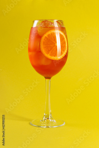 Orange cocktail. Aperol syringe. On a yellow background.