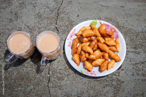 Tibetan Salt Ghee Tea and Khapse Deep Fried Doughnut Snack, a Himalayan Food in Nepal photo