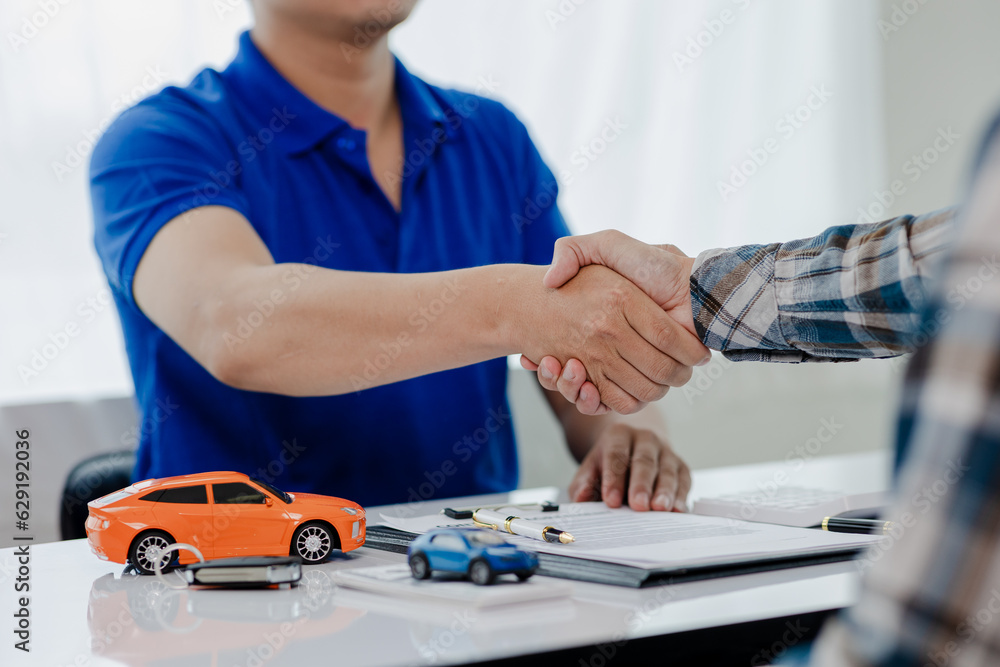 Car dealership, holding car keys to customer, new owner after signing lease contract, purchase contract in document, car sale contract.