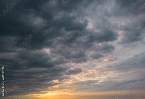 Fototapeta Naklejka Na Ścianę i Meble -  Rain Clouds in sunset sky. Natural background of cloudy sky