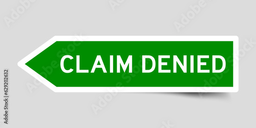 Green color arrow shape sticker label with word claim denied on gray background