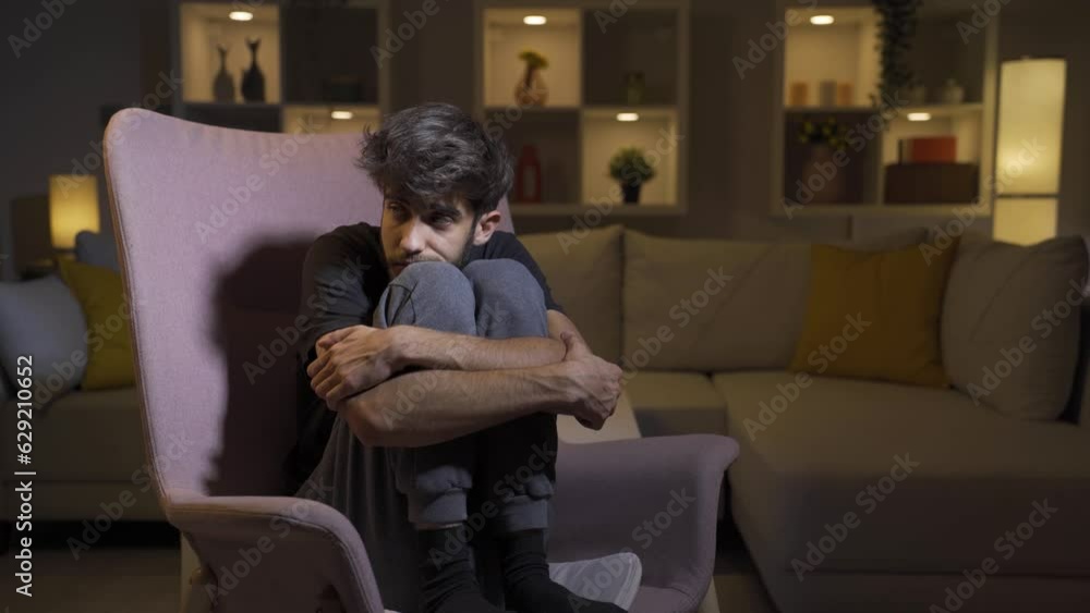 Fearful man. He is in a bad mood at home. Fearful man. He is in a bad mood at home.