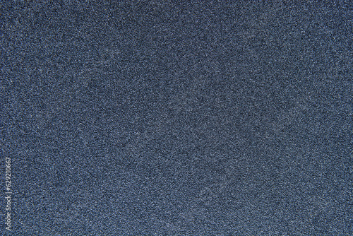 Black sandpaper texture. Dark gray emery paper textured background. photo