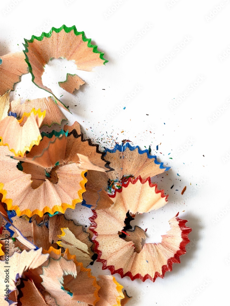 Pile of colorful wooden pencil shavings on a white background Pile of colorful wooden pencil shavings on a white background