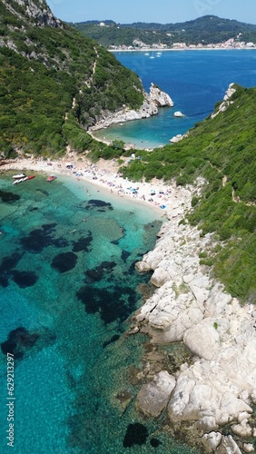 Aerial view of the rocky shoreline of Corfu, Greece with its crystal clear blue ocean waters.